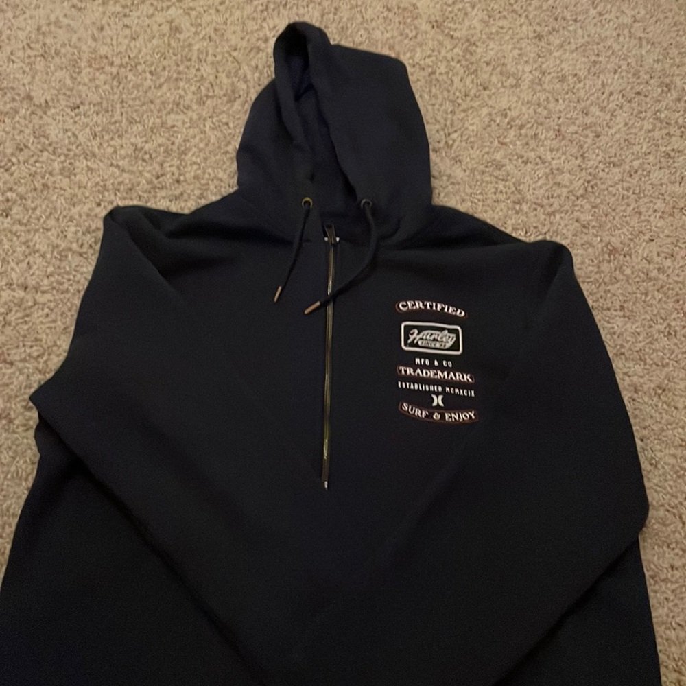 never worn, brand is hurley, navy blue zip up